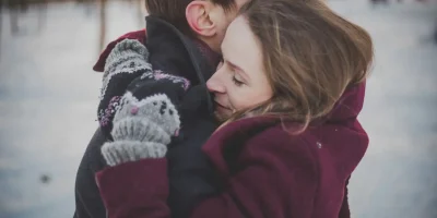 couple hugging in the snow